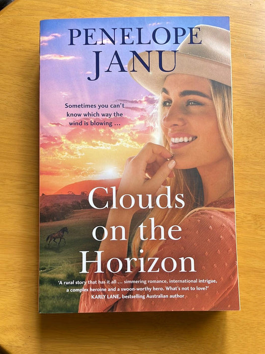 Book: Clouds on the horizon by Penelope Janu - Scroll through thrift