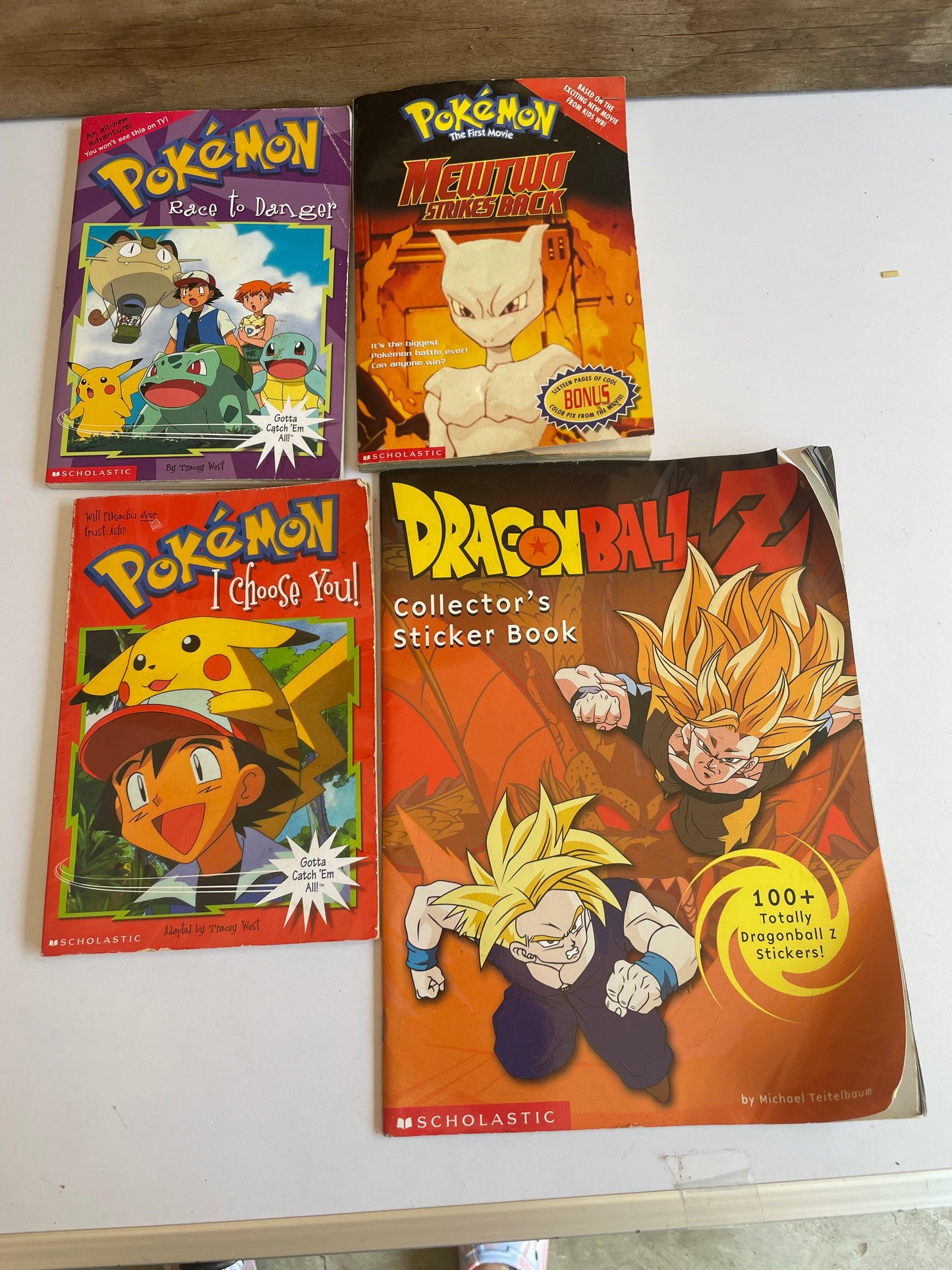 x3 old pokemon books and dragon ball z sticker book - Scroll through thrift